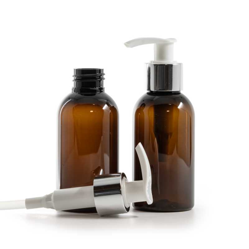 Bernsteinfarbene Kunststoffflasche, weiße Lotion-Pumpe mit glänzendem Silberkragen, 100 ml