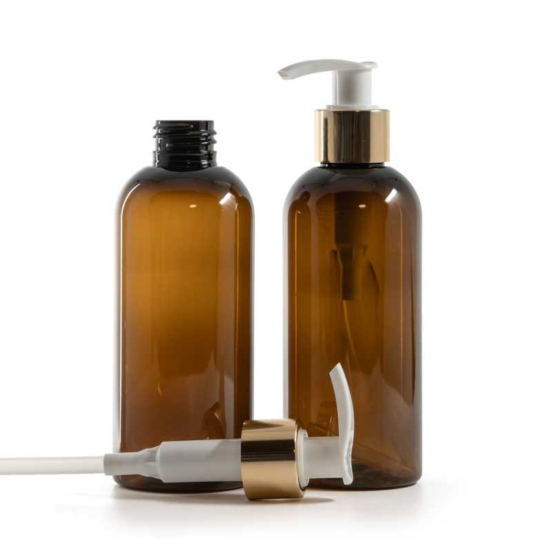 Bernsteinfarbene Kunststoffflasche, weiße Lotionpumpe mit glänzendem Goldkragen, 200 ml