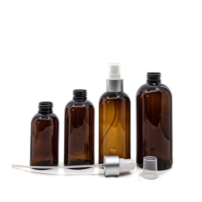 Bernsteinfarbene Kunststoffflasche, weißes Spray mit mattsilbernem Kragen, 100 ml