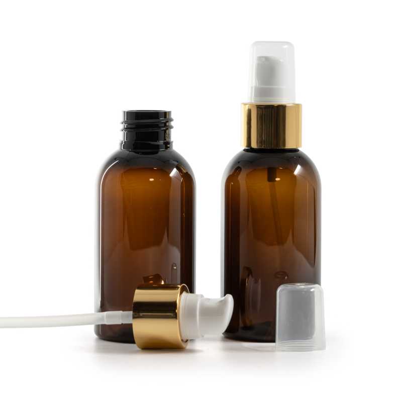 Bernsteinfarbene Kunststoffflasche, weiße Lotionpumpe mit Überkappe, goldglänzend, 100 ml