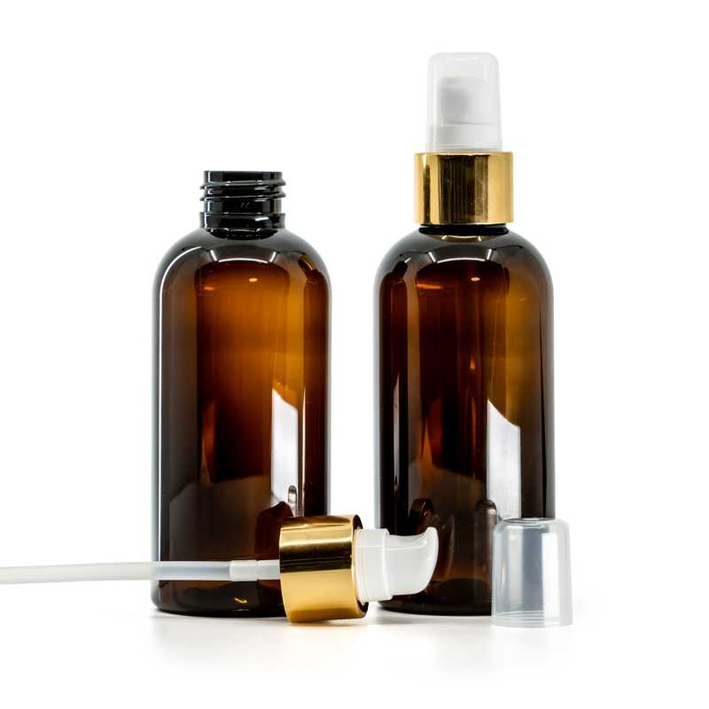 Bernsteinfarbene Kunststoffflasche, weiße Lotionpumpe mit Überkappe, goldglänzend, 150 ml