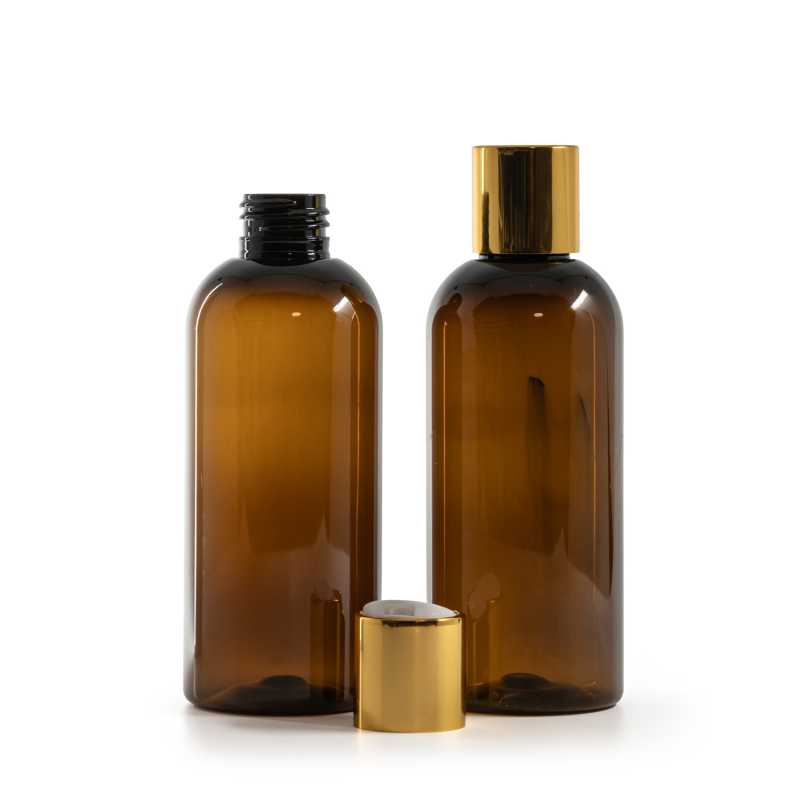 Bernsteinfarbene Kunststoffflasche, weißer Kunststoff-Kippverschluss mit goldenem Aluminiumkragen, 2