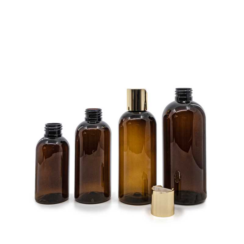 Bernsteinfarbene Kunststoffflasche, goldener Scheibendeckel, 100 ml