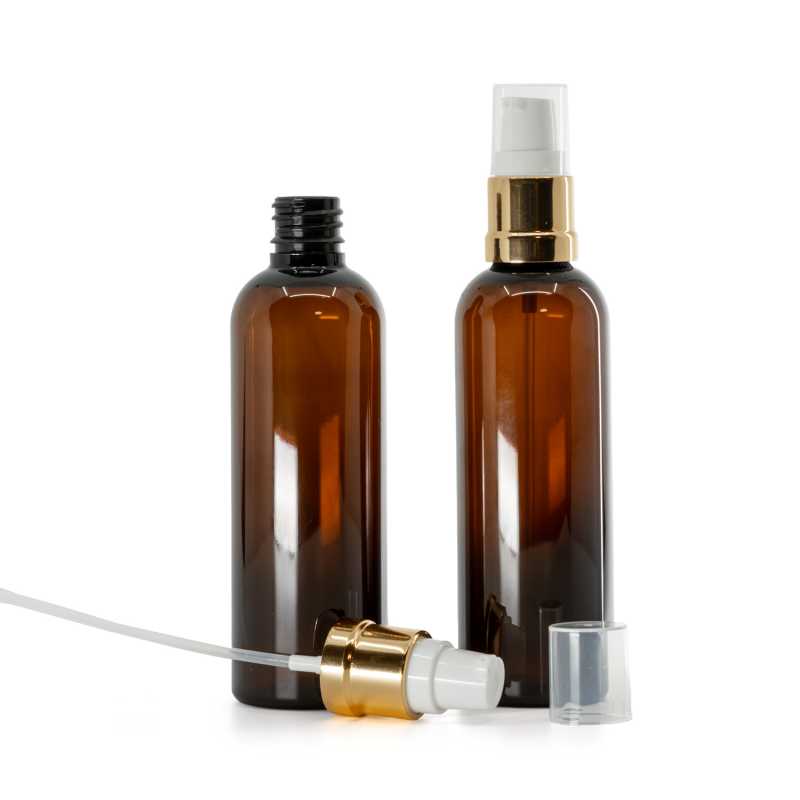 Bernsteinfarbene Kunststoffflasche, glänzende goldweiße Pumpe, 100 ml