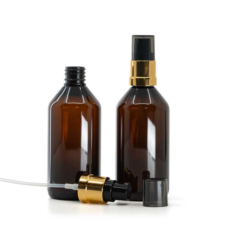 Braune Kunststoffflasche, schwarz-goldener glänzender Dispenser mit rauchfarbener Überkappe, 115 ml