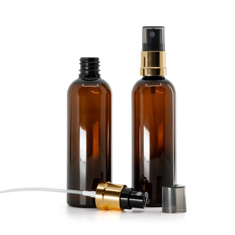 Braunes Kunststofffläschchen, schwarz-goldener Zerstäuber, rauchfarbene Überkappe, 100 ml