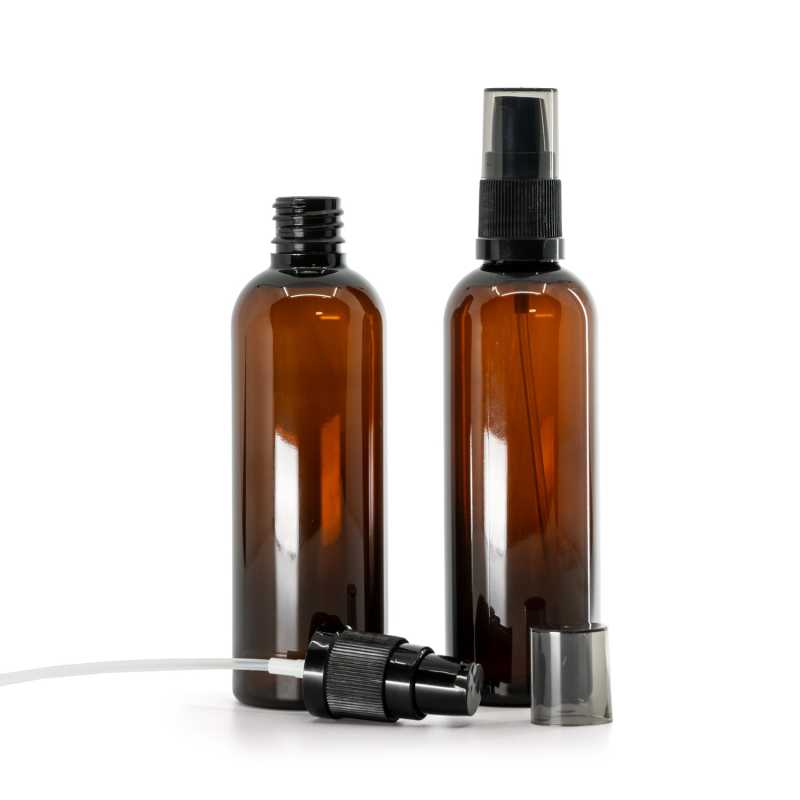 Bernsteinfarbene Kunststoffflasche, schwarze Lotion-Pumpe mit rauchfarbenem Überkappen, 100 ml