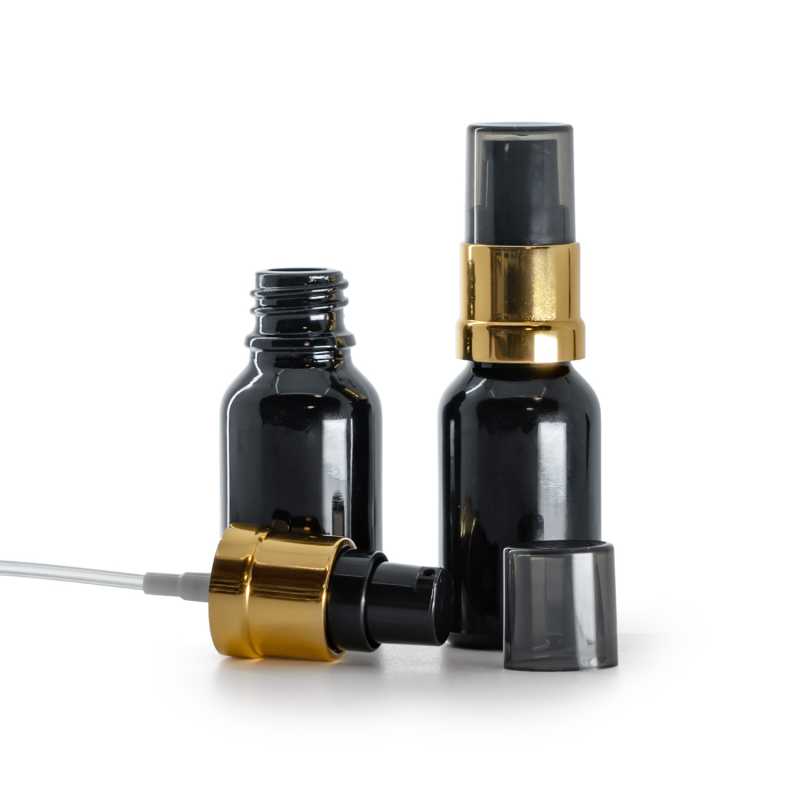 Glasfläschchen, glänzend schwarz, glänzender schwarz-goldener Dosierspender mit rauchfarbener Überka