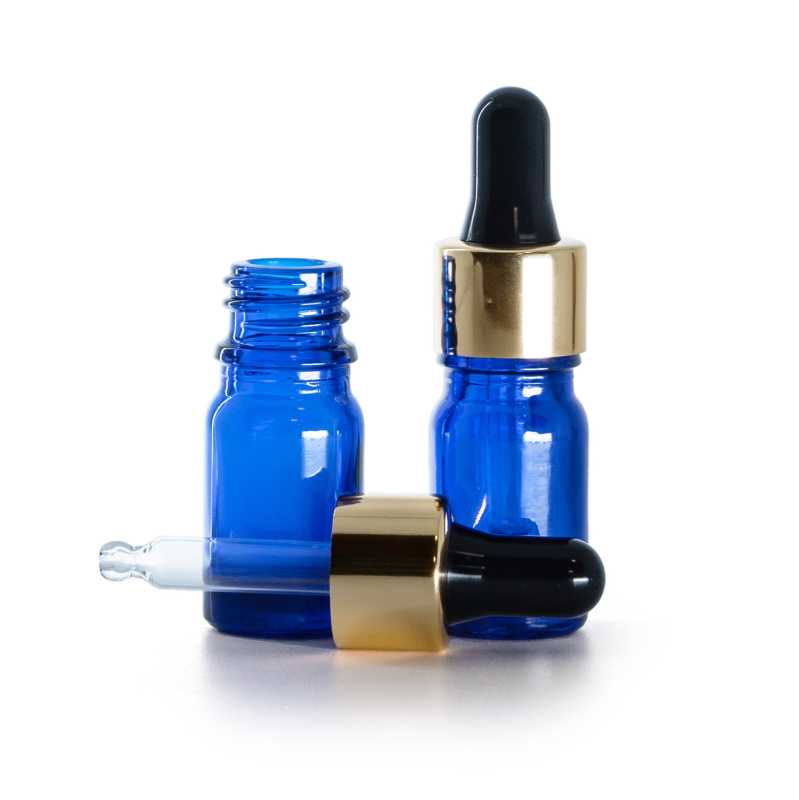 Blaue Glasflasche, gold-schwarze Pipette, 5 ml