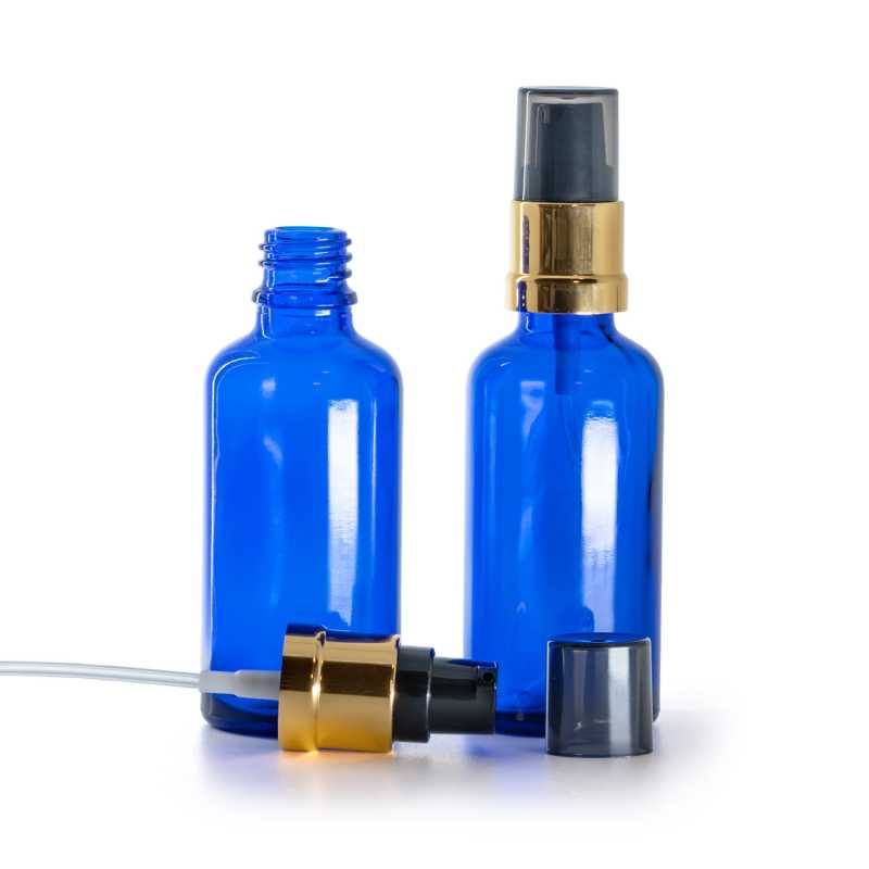 Blaues Glasfläschchen, schwarz-goldene glänzende Pumpe mit rauchfarbener Überkappe, 50 ml