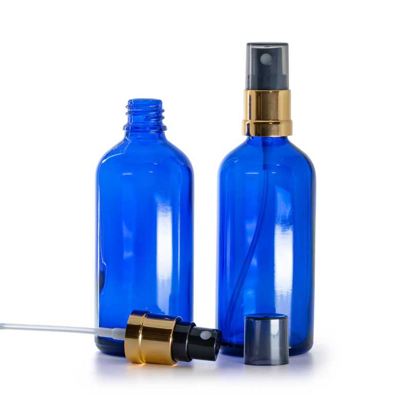 Blaues Glasfläschchen, schwarz-goldener Zerstäuber, rauchfarbene Überkappe, 100 ml