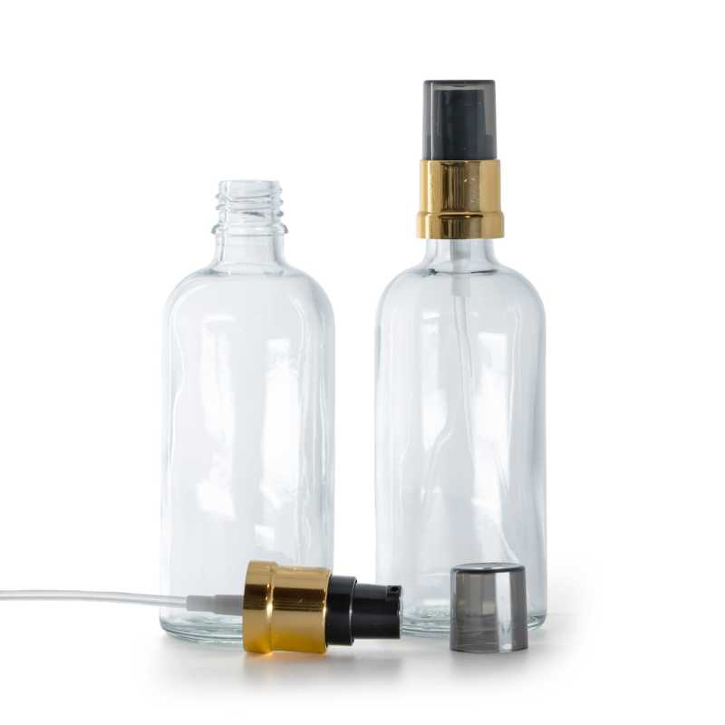 Glasfläschchen, transparent, glänzende schwarz-goldene Pumpe mit rauchfarbener Überkappe, 100 ml