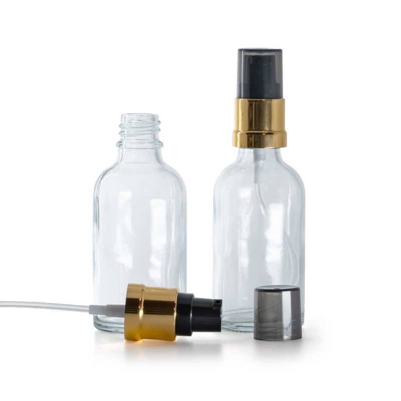 Glasfläschchen, transparent, glänzende schwarz-goldene Pumpe mit rauchfarbener Überkappe, 30 ml