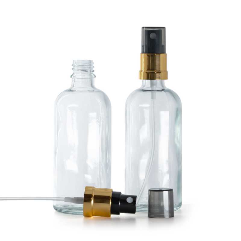 Klare Glasflasche, schwarzer Sprühkopf mit goldener Hülse, Rauchkappe, 100 ml