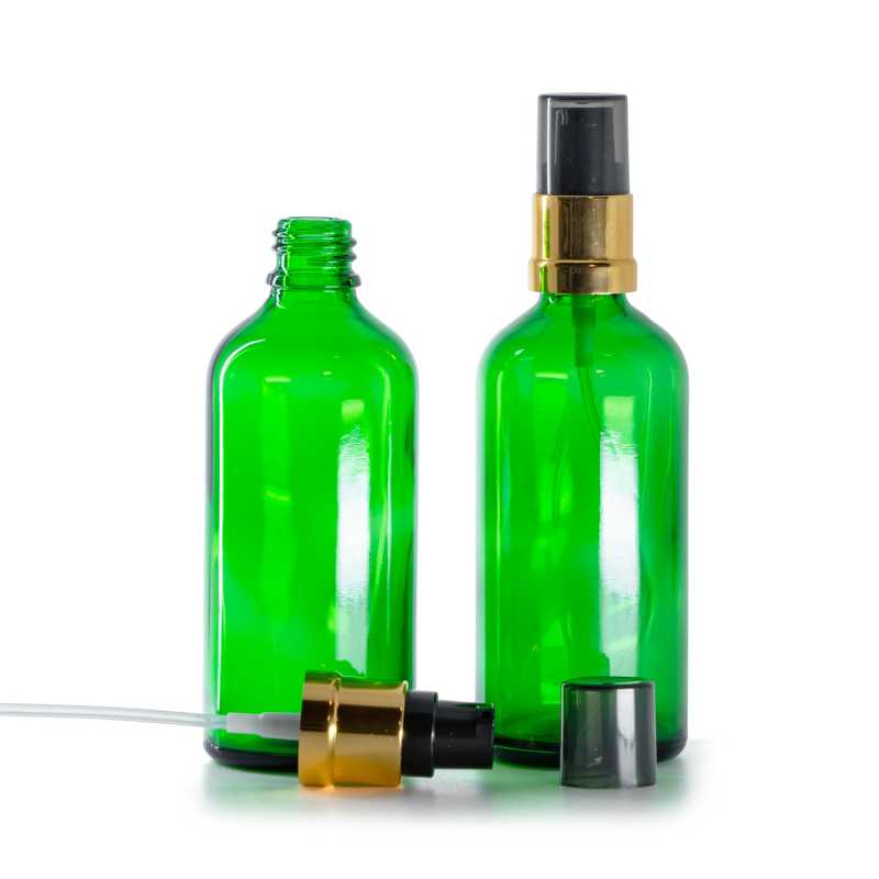 Grünes Glasfläschchen, glänzender schwarz-goldener Dispenserspender mit rauchfarbener Überkappe, 100