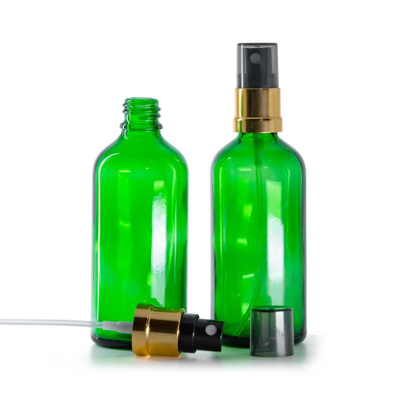 Grüne Glasflasche, schwarzer Sprühkopf mit glänzender Goldhülse, Rauchkappe, 100 ml